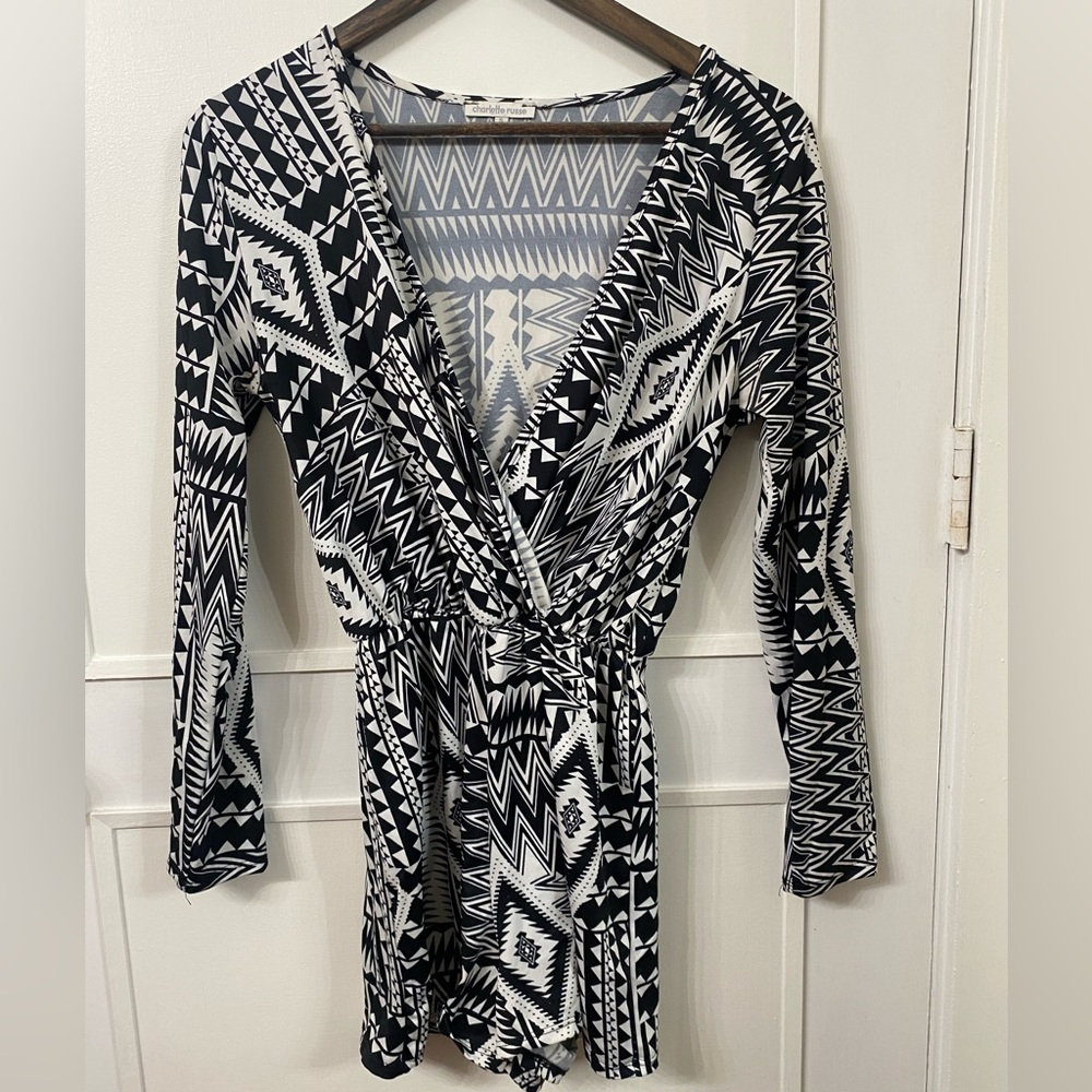 Long sleeve, plunge neck, shorts romper. Black and white pattern